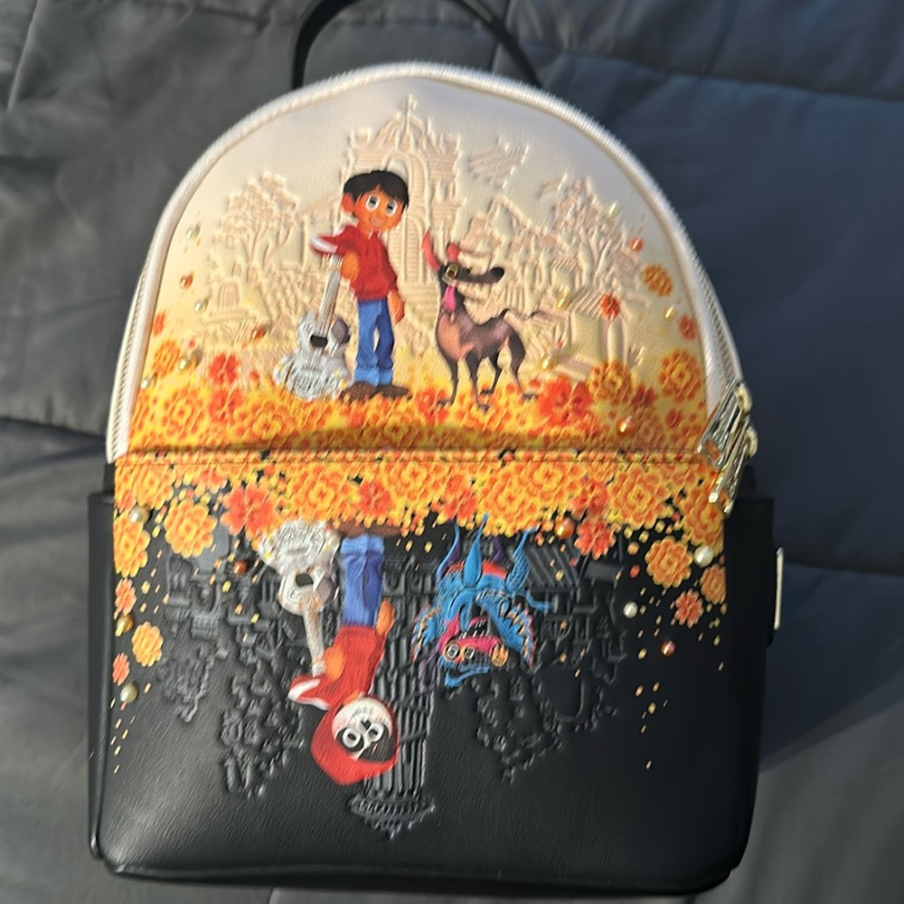 LOUNGEFLY Pixar Coco Marigold Mirror New. Never been used.